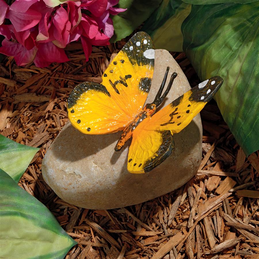 Yellow Mocker Swallowtail Butterfly on Rock Statue