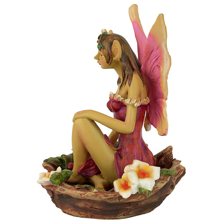 The Red and Green Fairy of Acorn Hollow Statues: Red